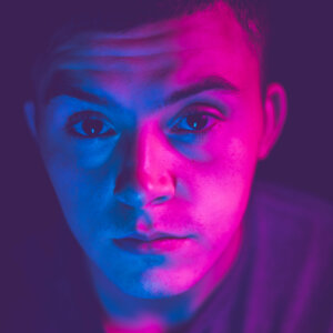 Young Man Up Close Portrait Blue Purple